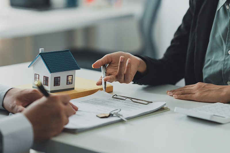 real estate professionals discussing business finances.